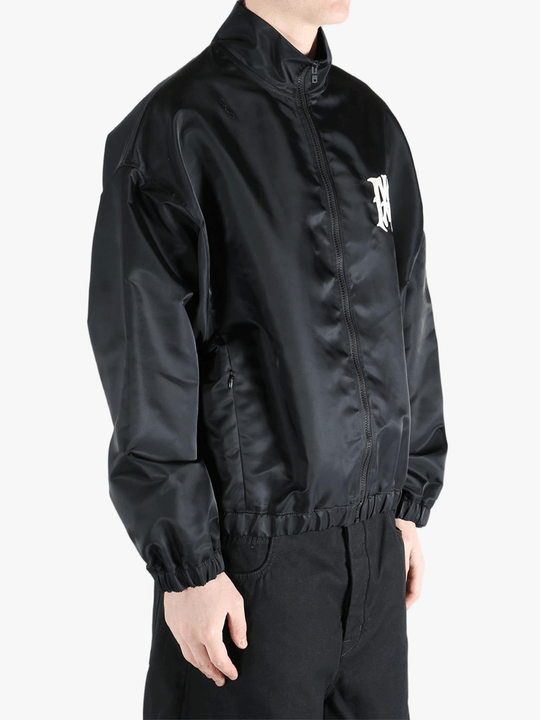 Black jacket worn by a person, showing the jacket's fit