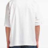 white t-shirt worn by a person, showing the t-shirt fit