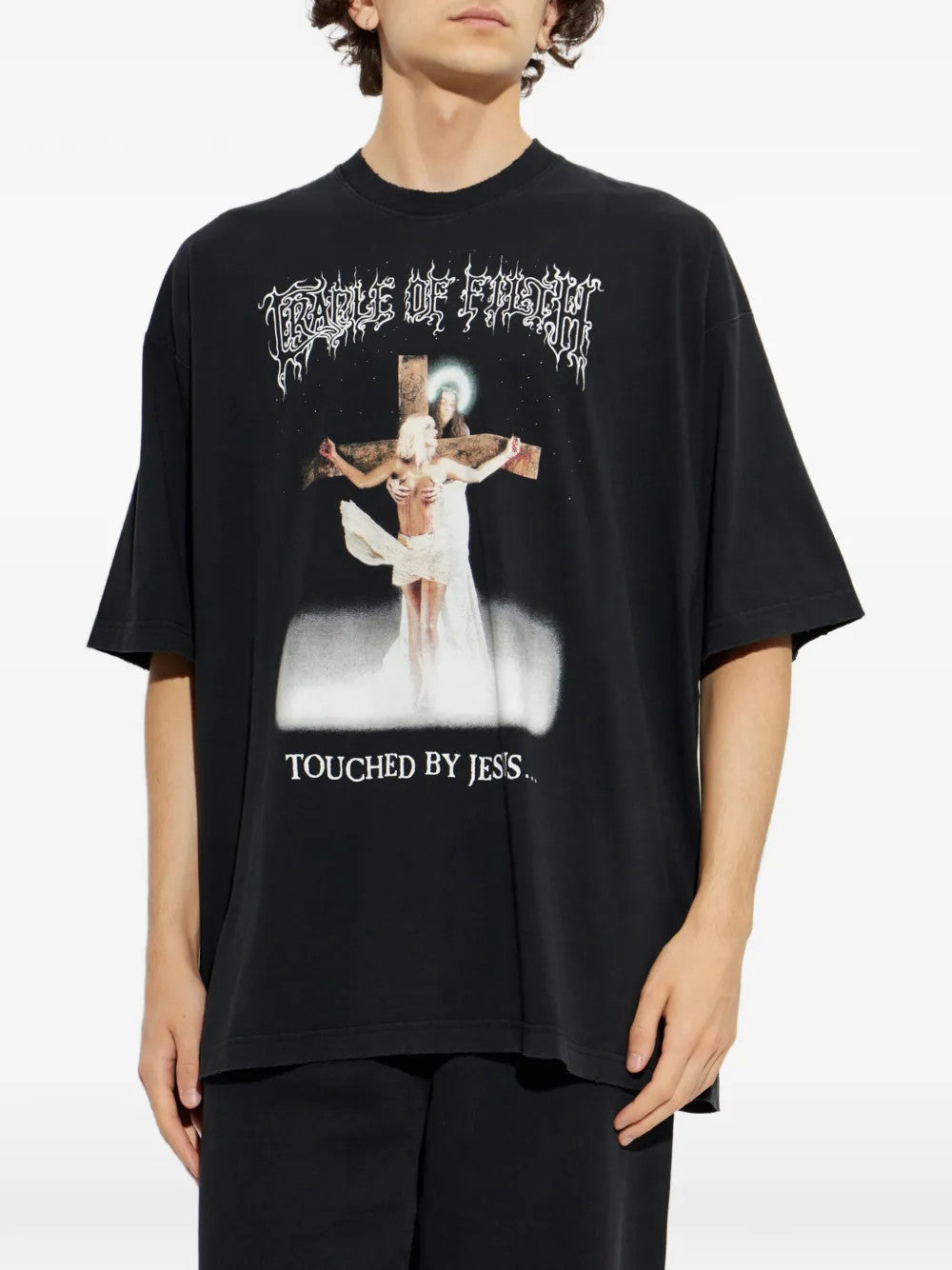 Black t-shirt worn by a person, showing the t-shirt fit