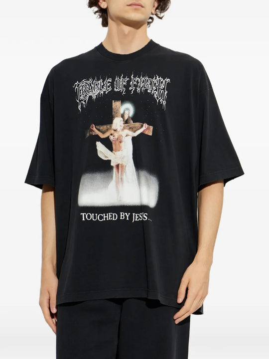 Black t-shirt worn by a person, showing the t-shirt fit