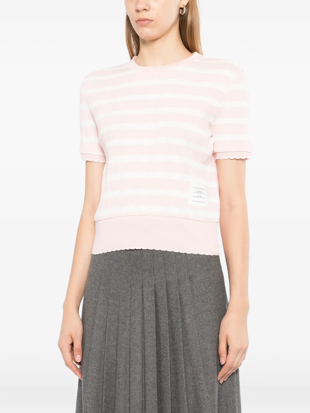 Pink t-shirt worn by a person, showing the t-shirt fit