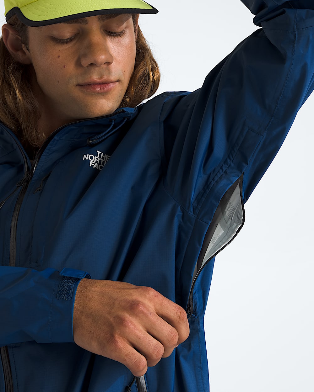 Blue jacket worn by a person, showing the jacket fit