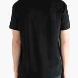 Black t-shirts worn by a person, showing the t-shirts fit