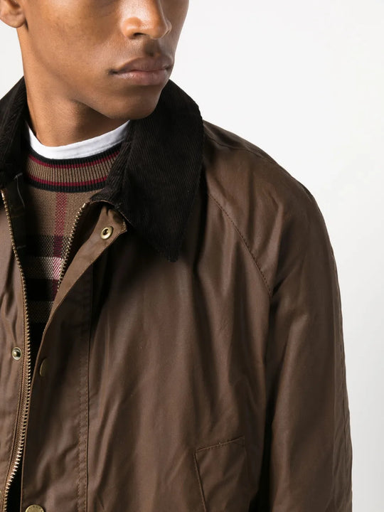 Brown jacket worn by a person, showing the jacket fit