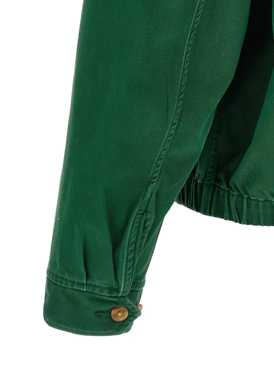 Close up of Green windbreaker, showing texture of the botton fabric