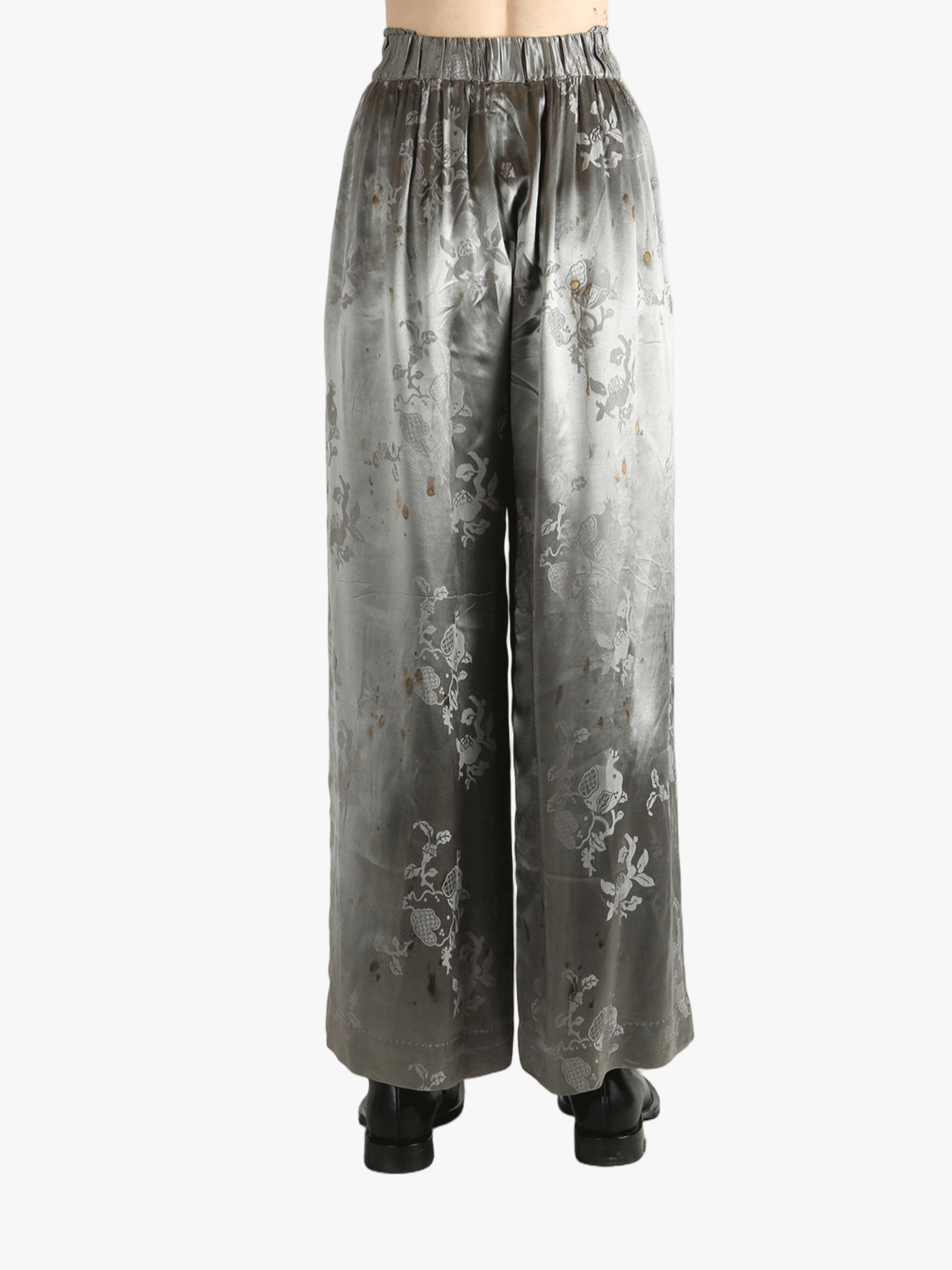 Grey pants worn by a person, showing the pants' fit