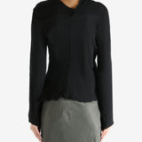 Black top worn by a person, showing the top's fit