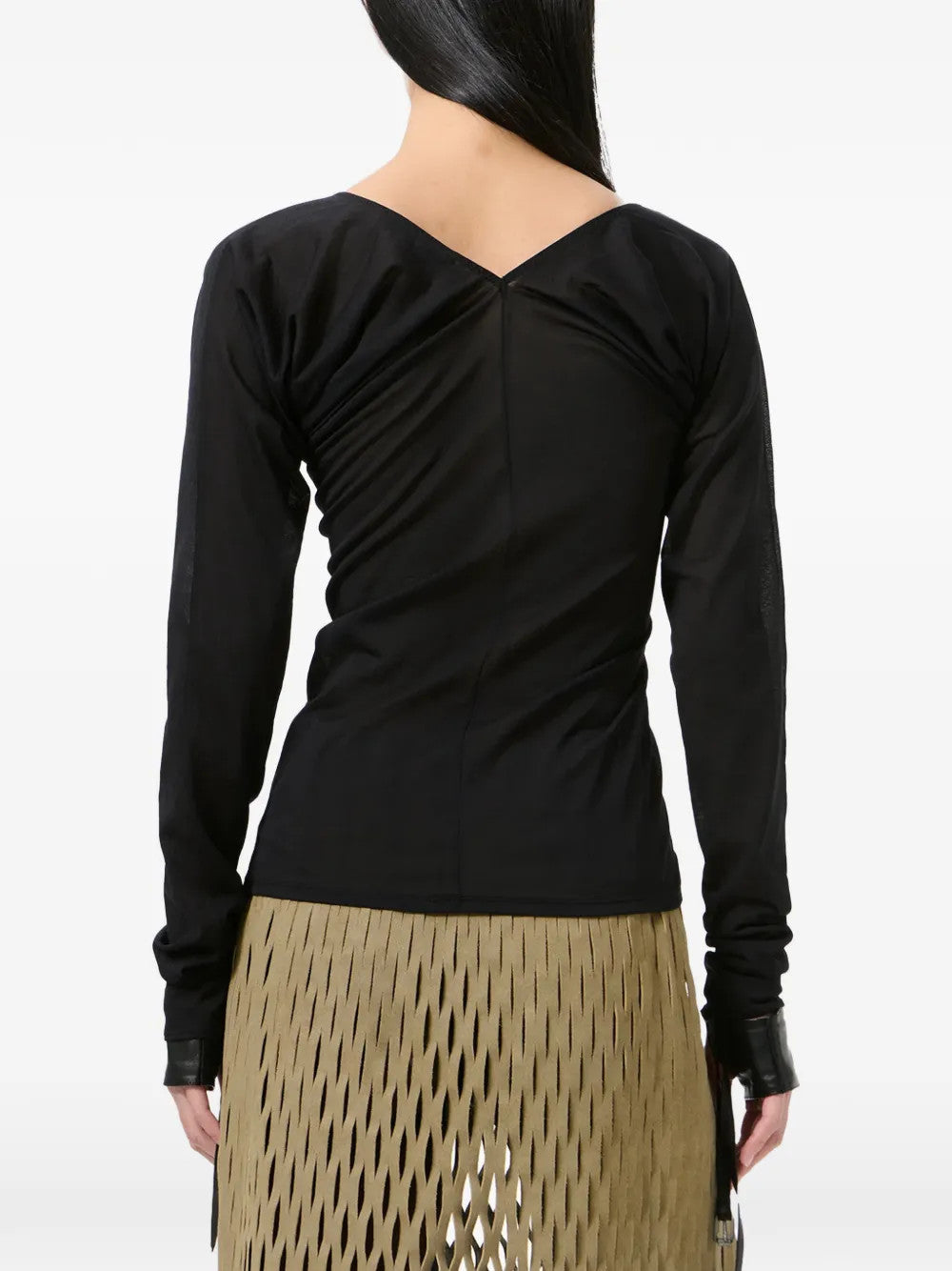 Black top worn by a person, showing the top fit