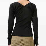 Black top worn by a person, showing the top fit