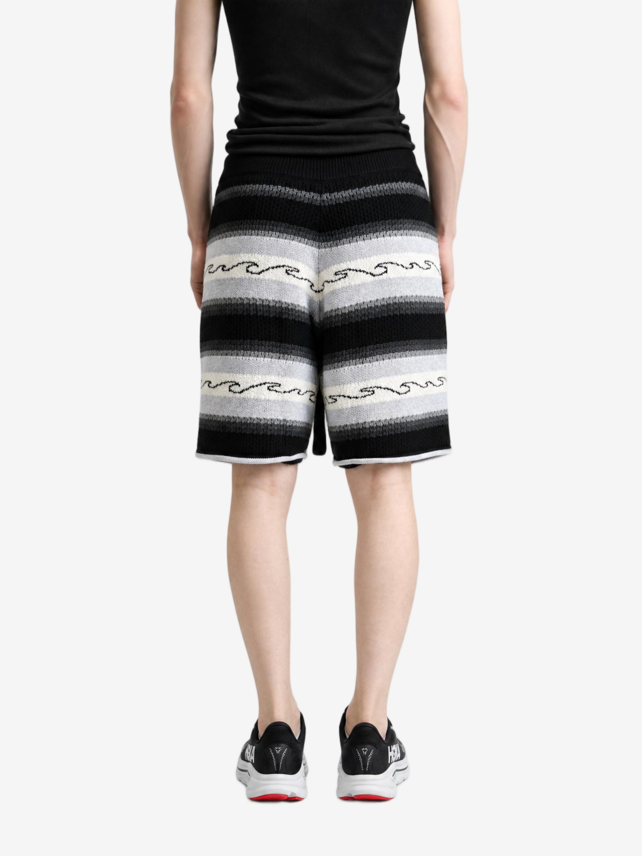 Black shorts worn by a person, showing the shorts fit