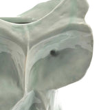 Close up of the blue vase, showing texture of the stone fabric