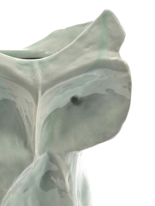 Close up of the blue vase, showing texture of the stone fabric