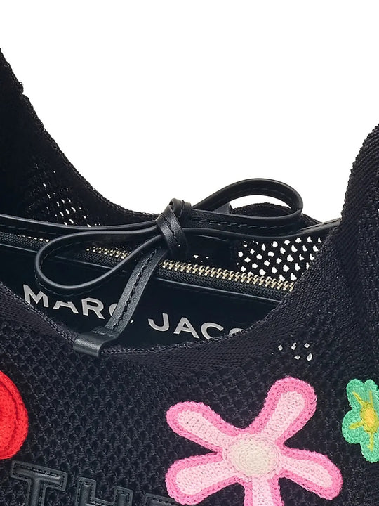 Close up of the black bag, showing texture of the cotton fabric