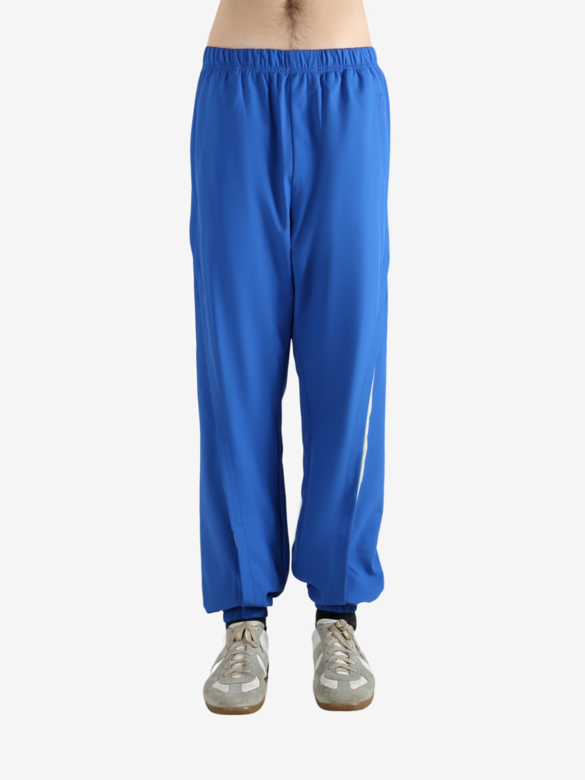 Blue pants worn by a person, showing the pants' fit