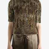 Grey knitwear worn by a person, showing the knitwear's fit