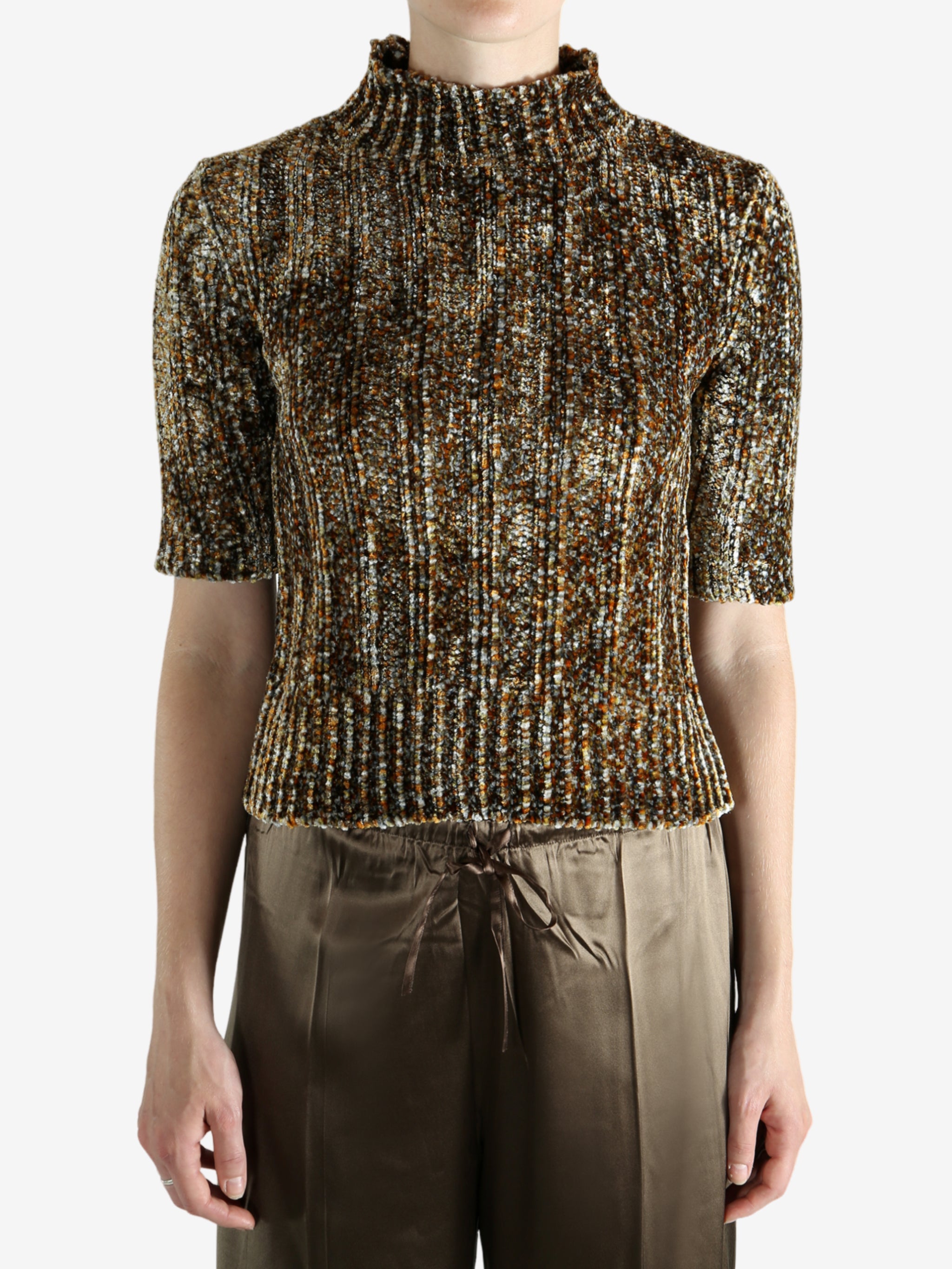 Grey knitwear worn by a person, showing the knitwear's fit