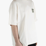 White t-shirt worn by a person, showing the t-shirt's fit