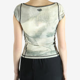 Green top worn by a person, showing the top's fit