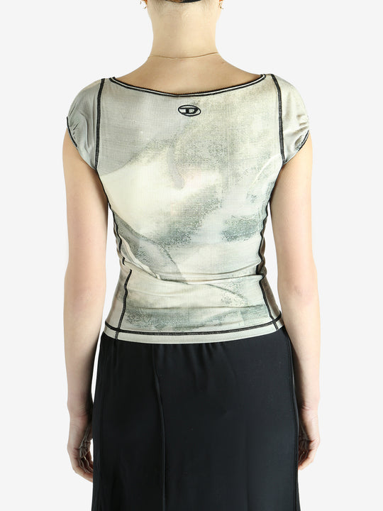 Green top worn by a person, showing the top's fit