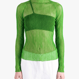 Green shirt worn by a person, showing the shirt fit