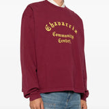 Burgundy t-shirt worn by a person, showing the t-shirt fit