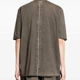 Grey t-shirts worn by a person, showing the t-shirts fit