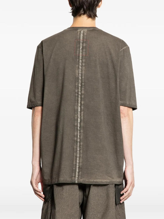 Grey t-shirts worn by a person, showing the t-shirts fit