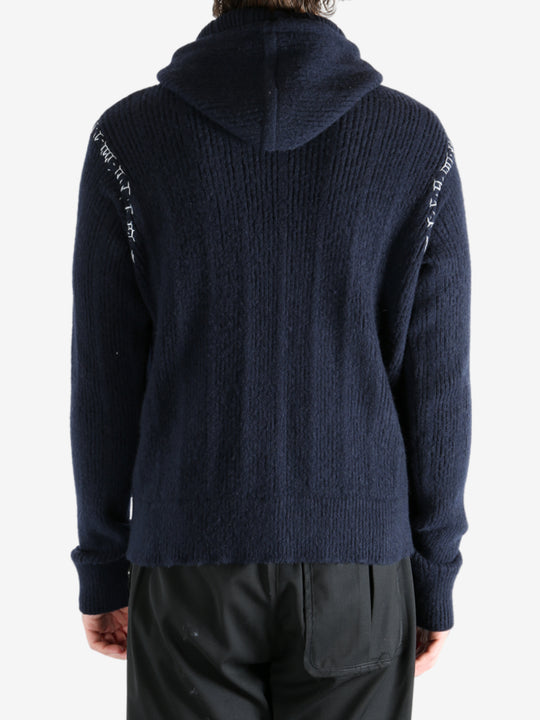 Navy cardigan worn by a person, showing the cardigan's fit