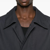 Close up of black coat, showing texture of the cotton fabric