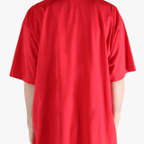 Red t-shirt worn by a person, showing the t-shirt fit