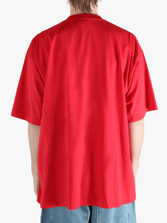 Red t-shirt worn by a person, showing the t-shirt fit