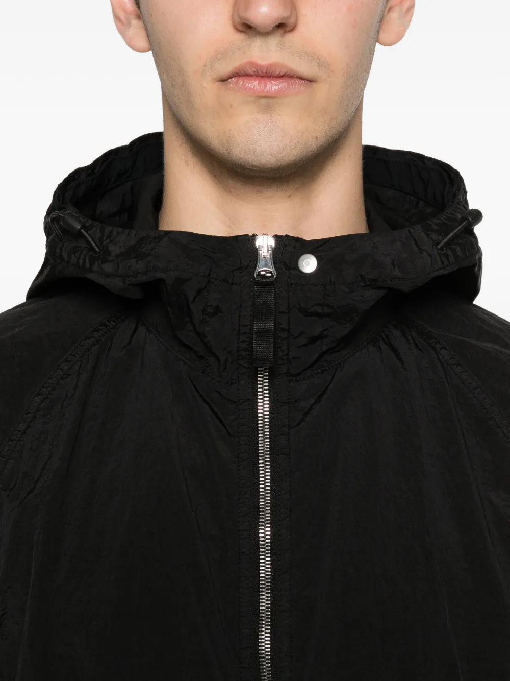 Close up of Black parka, showing texture of the polyamide fabric