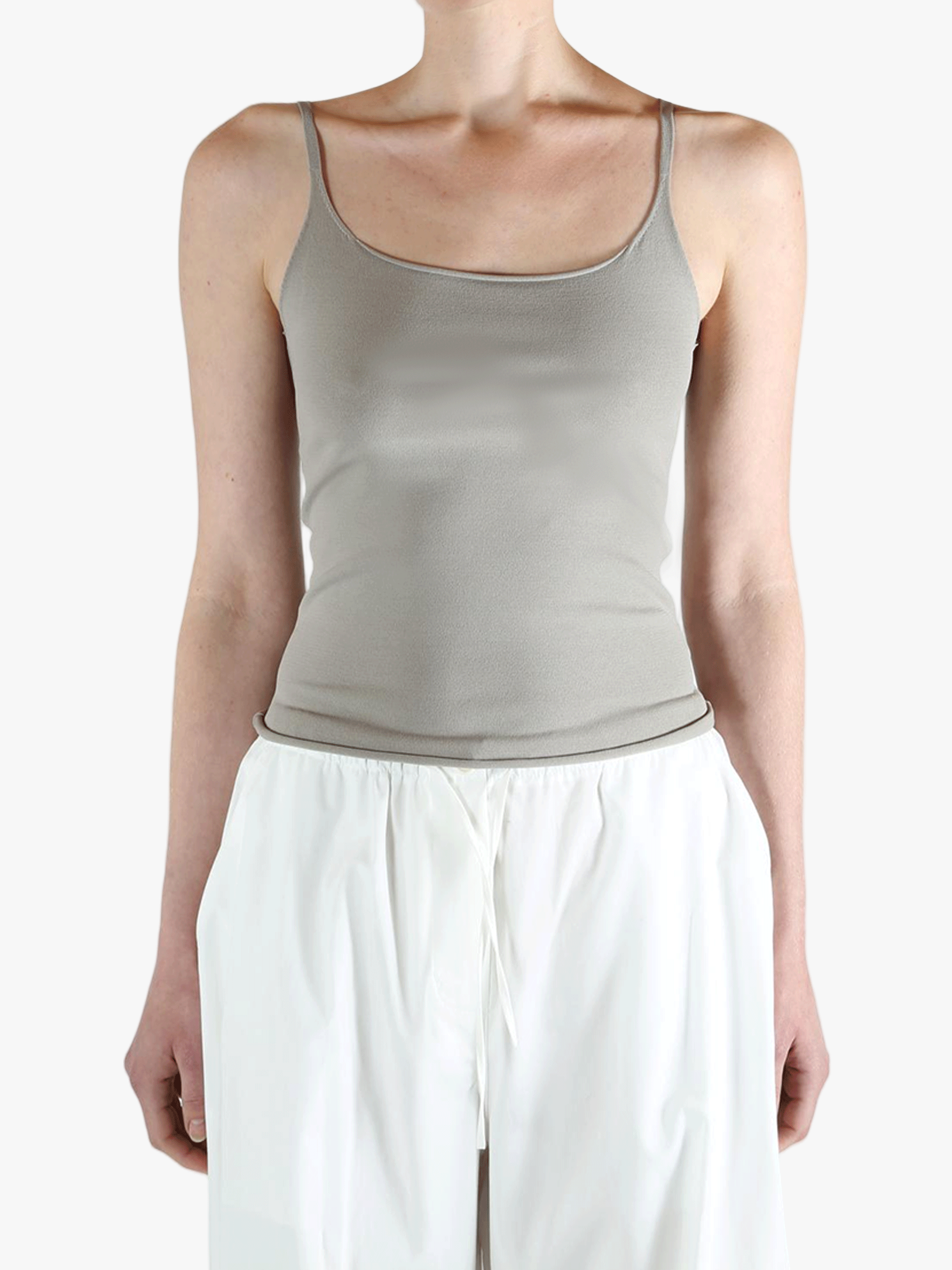 Grey tops worn by a person, showing the tops fit