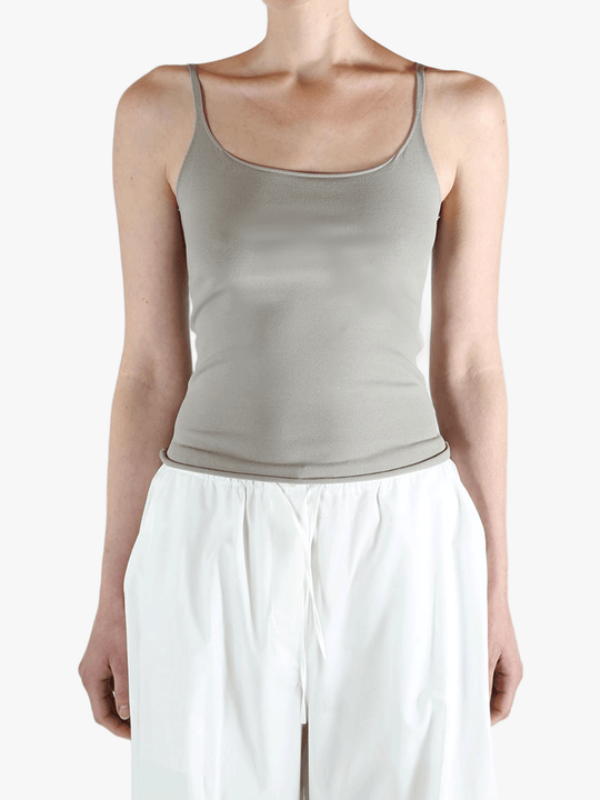 Grey tops worn by a person, showing the tops fit