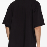 Black t-shirt worn by a person, showing the shirt's fit