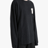 Black t-shirt worn by a person, showing the t-shirt fit