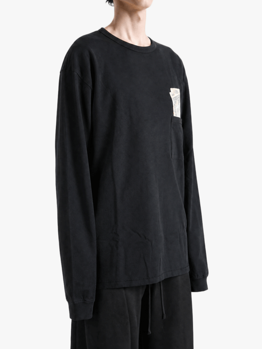 Black t-shirt worn by a person, showing the t-shirt fit