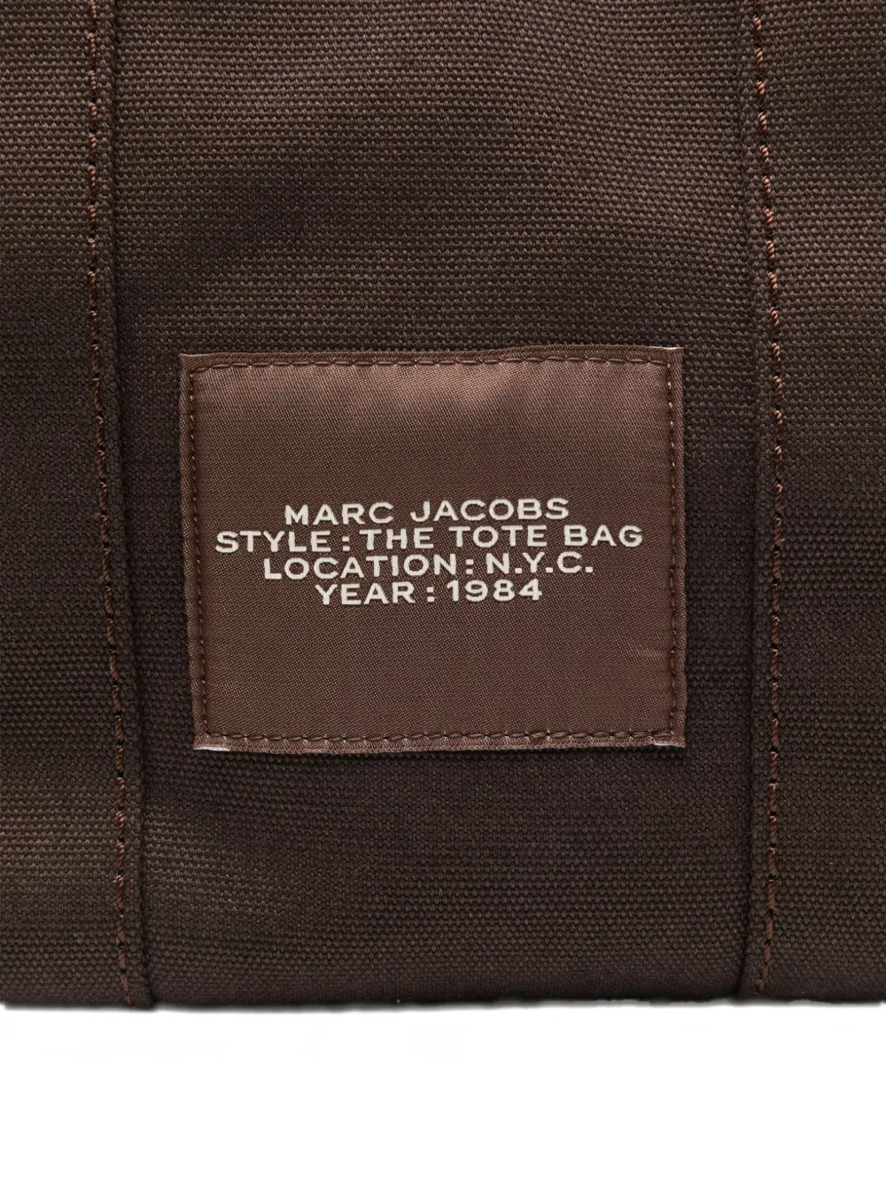 Close up of brown bag, showing brand logo