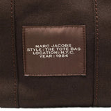 Close up of brown bag, showing brand logo