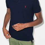 Navy shirts worn by a person, showing the shirt's fit