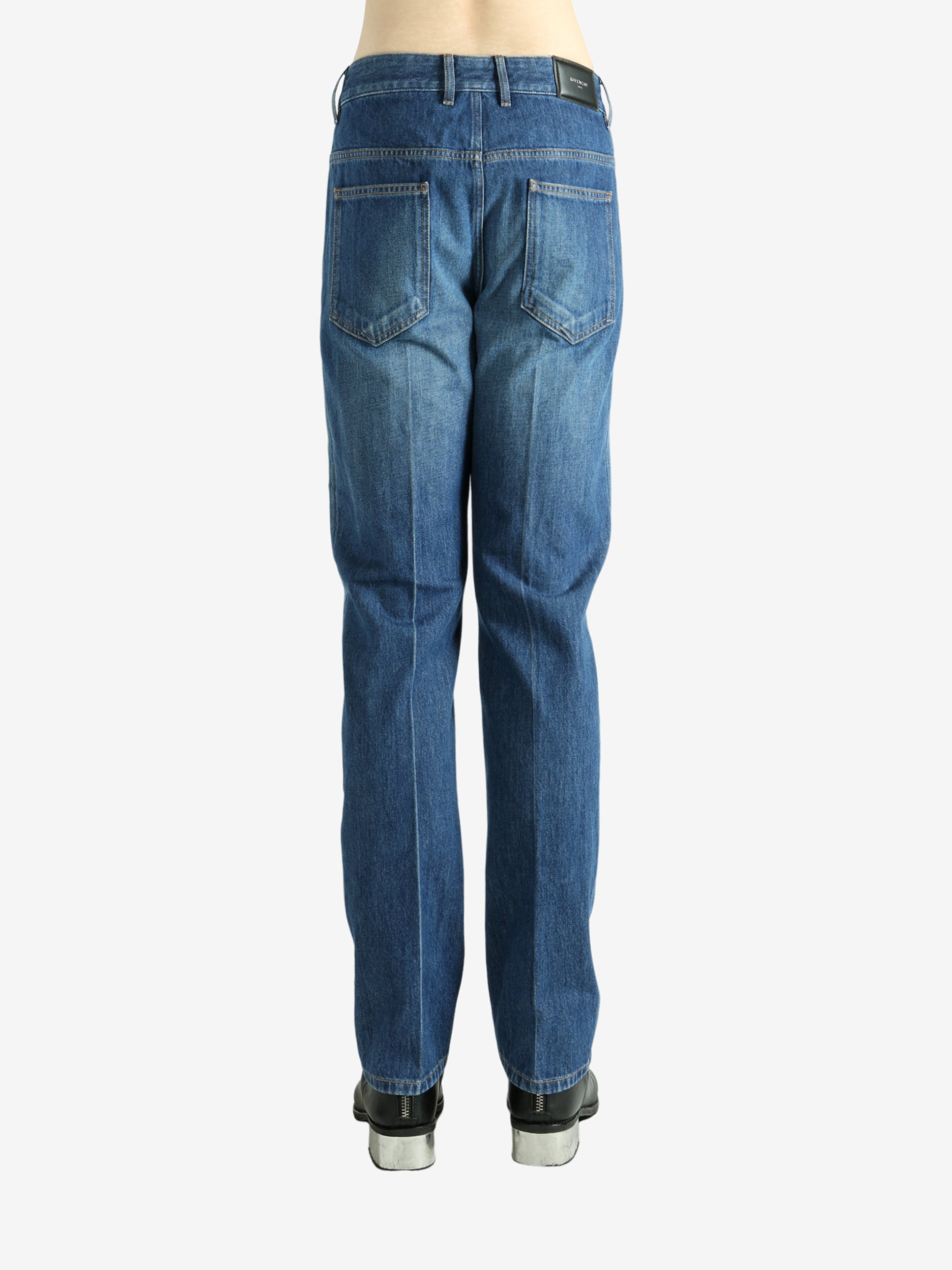 Blue pants worn by a person, showing the pants fit