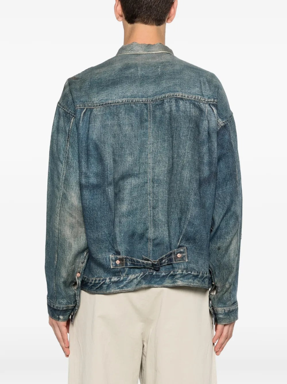 Blue jackets worn by a person, showing the jackets fit