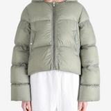 Green jacket worn by a person, showing the jacket fit