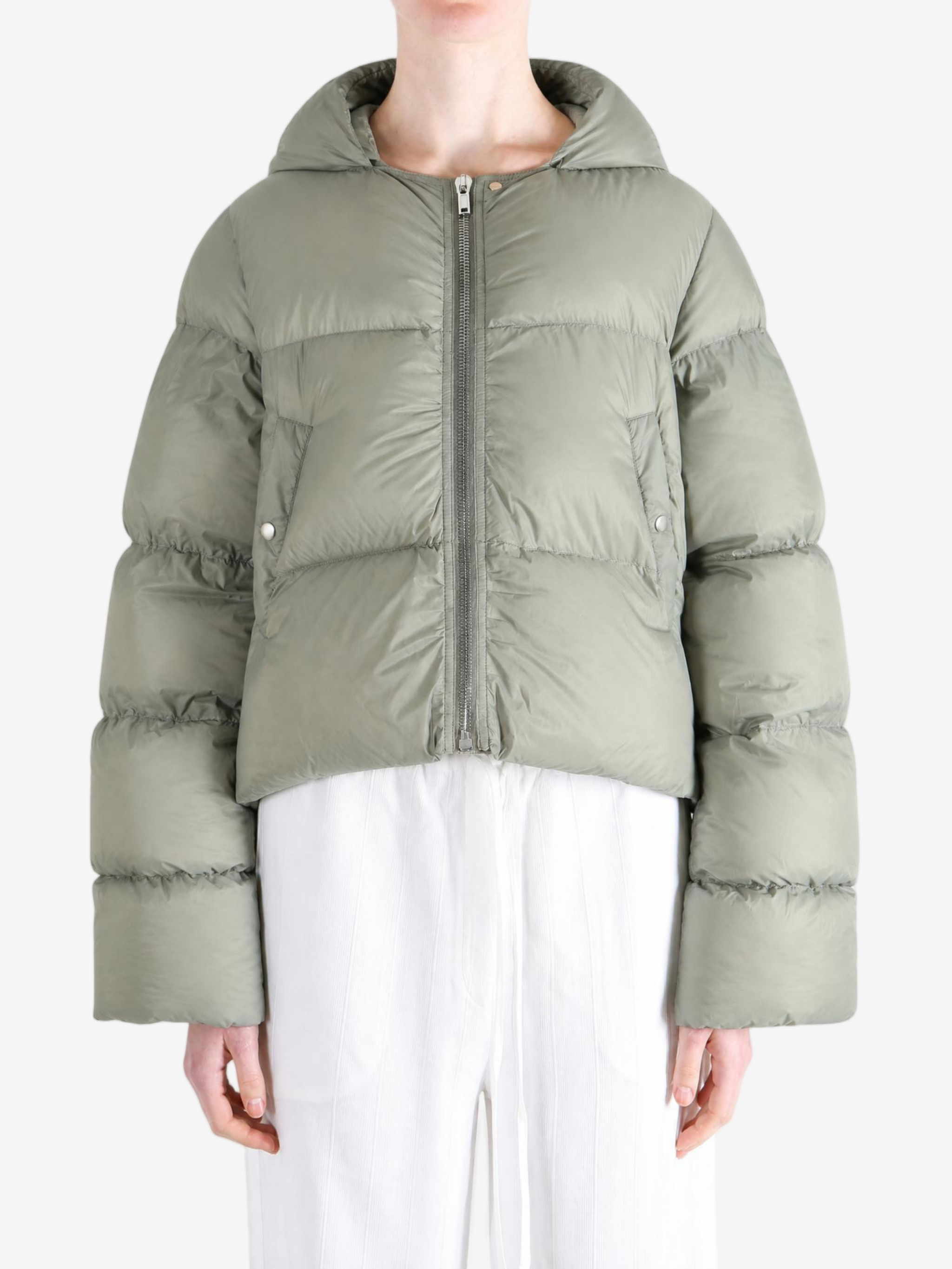 Green jacket worn by a person, showing the jacket fit