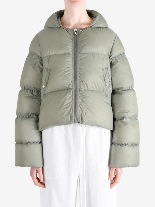 Green jacket worn by a person, showing the jacket fit
