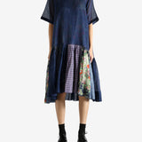 Navy dress worn by a person, showing the dress's fit