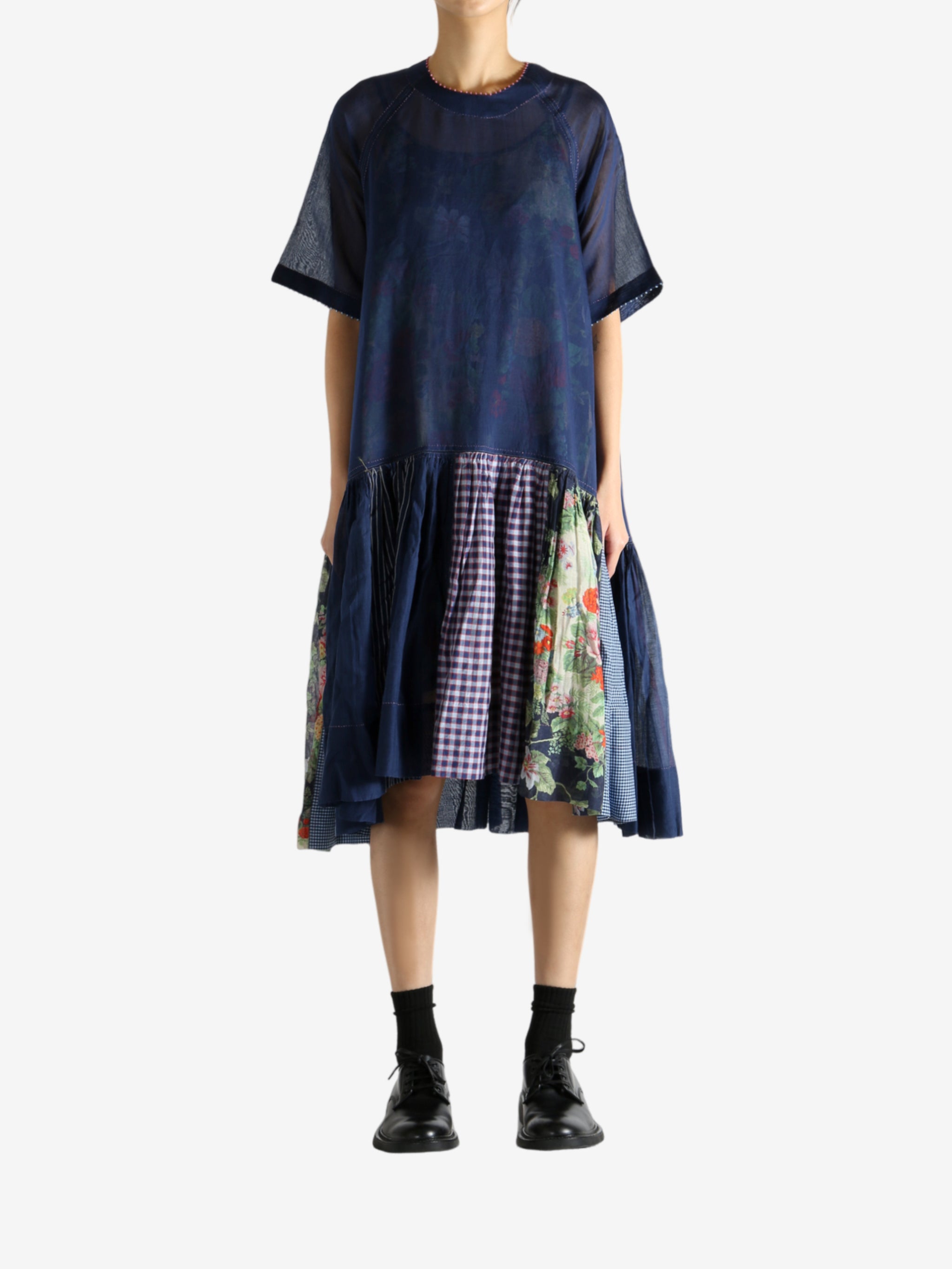 Navy dress worn by a person, showing the dress's fit