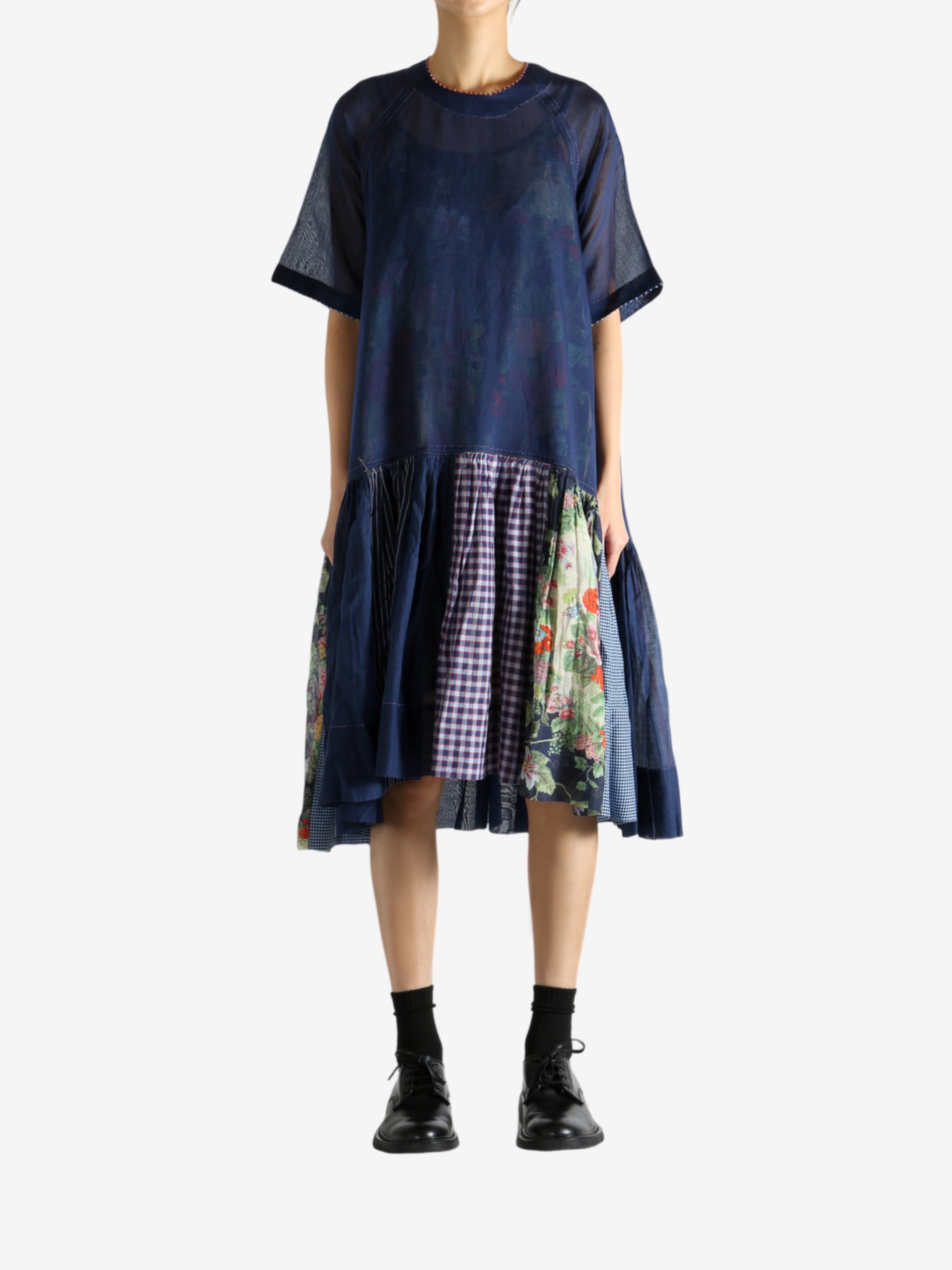 Navy dress worn by a person, showing the dress's fit