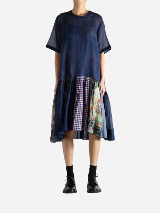 Navy dress worn by a person, showing the dress's fit