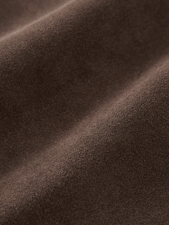Close-up of Brown jacket，showing texture of the 100% cow leather fabric